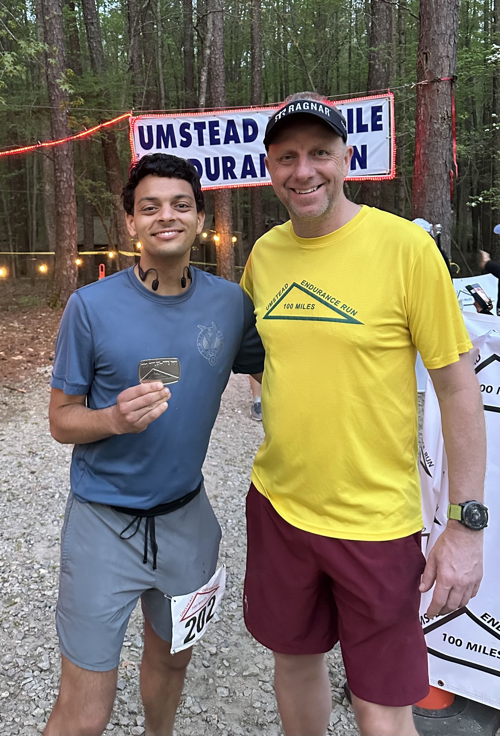 JT and I at the finish line with my belt buckle